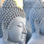 Statues of the Buddha sitting in meditation